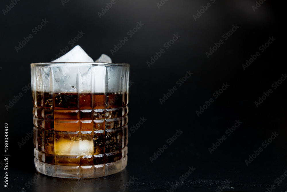 Refreshing black soda soft drinks with ice in a clear glass Refreshing black soda soft drinks with ice in a clear glass
