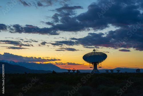 Fototapeta Naklejka Na Ścianę i Meble -  Silhouette of a large radio dish at Owens Valley Radio Observatory at dusk 