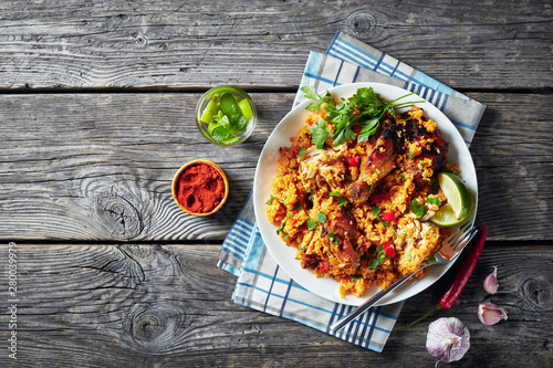 Arroz con pollo, chicken with rice and veggies photo