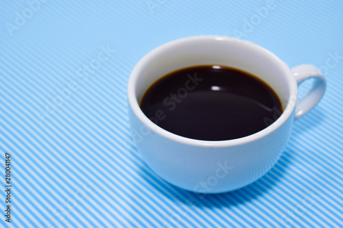 Coffee cup, blue pattern background