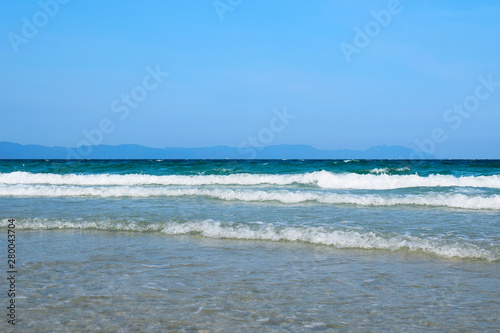 Panorama of a deserted beach with clear blue water. Cold North sea. Travel and leisure concept. Tourist background. Screensaver on your computer.