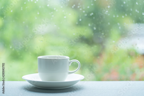 White coffee cup on a rainy day