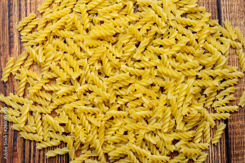 spaghetti, fusilli, macaroni, pasta traditional Italian on wooden background close up selective focus