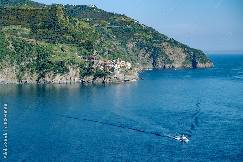 Sea rock coast, view from Corniglia, Italy. Blue water wave at Cinque Terre, Liguria Sea rock coast, view from Corniglia, Italy. Blue water wave at Cinque Terre, Liguria