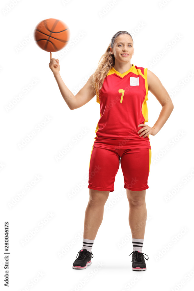 Young female basketball player spinning a ball with a finger