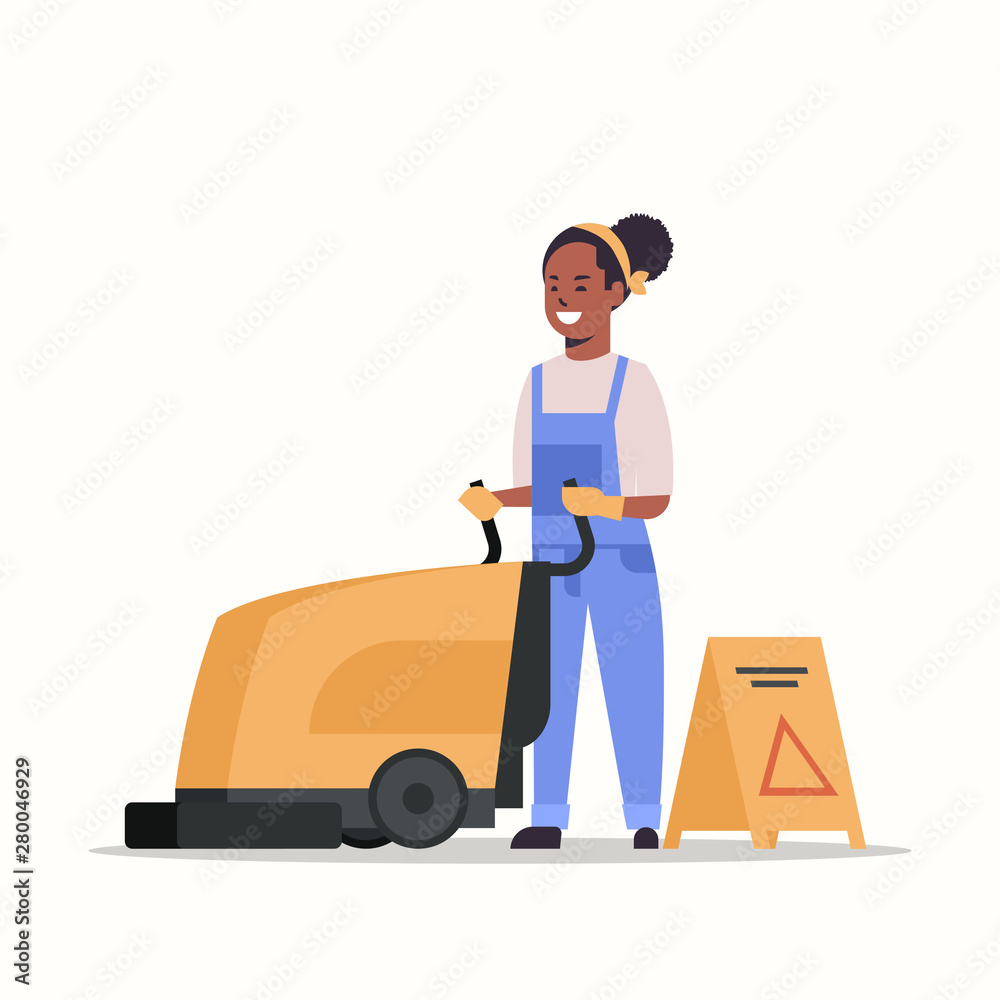 Woman using professional washing machine African American Woman using professional washing machine African American