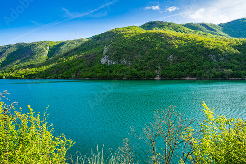 Montenegro, Water reservoir of jezero liverovoci in green valley surrounded by mountains covered by trees and forest nature landscape of niksic city
