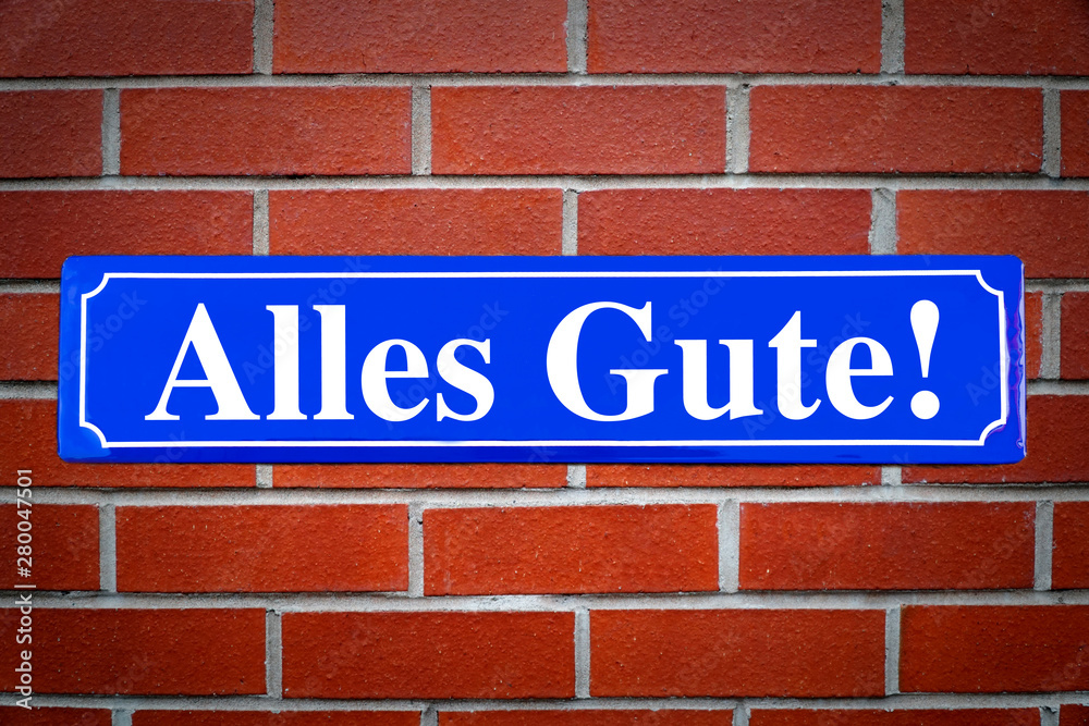 Alles Gute Schild blau an Backsteinwand Alles Gute Schild blau an Backsteinwand