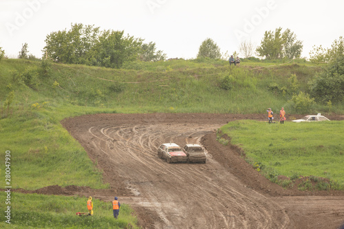 Traditional rally .The racing car drives into a steep turn, scattering, spraying dirt, dust. Extreme rally, autocross