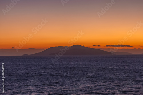 Awesome sunset with islands of the Aegean Sea at horizon