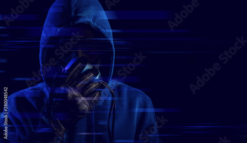 hacker man hood outfit mask with glove on dark background in security virus network and ai hologram robotic concept, data deep learning, server security hacking © issaronow