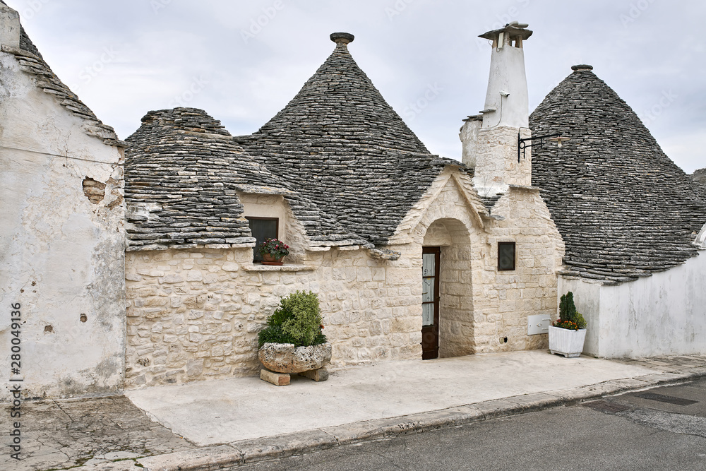Fototapeta premium Old trulli houses in Alberobello town in Italy