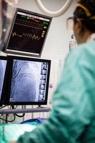 Modern Cath Lab with doctors, nurses and patients in hospital, patients during treatment in the Cath Lab