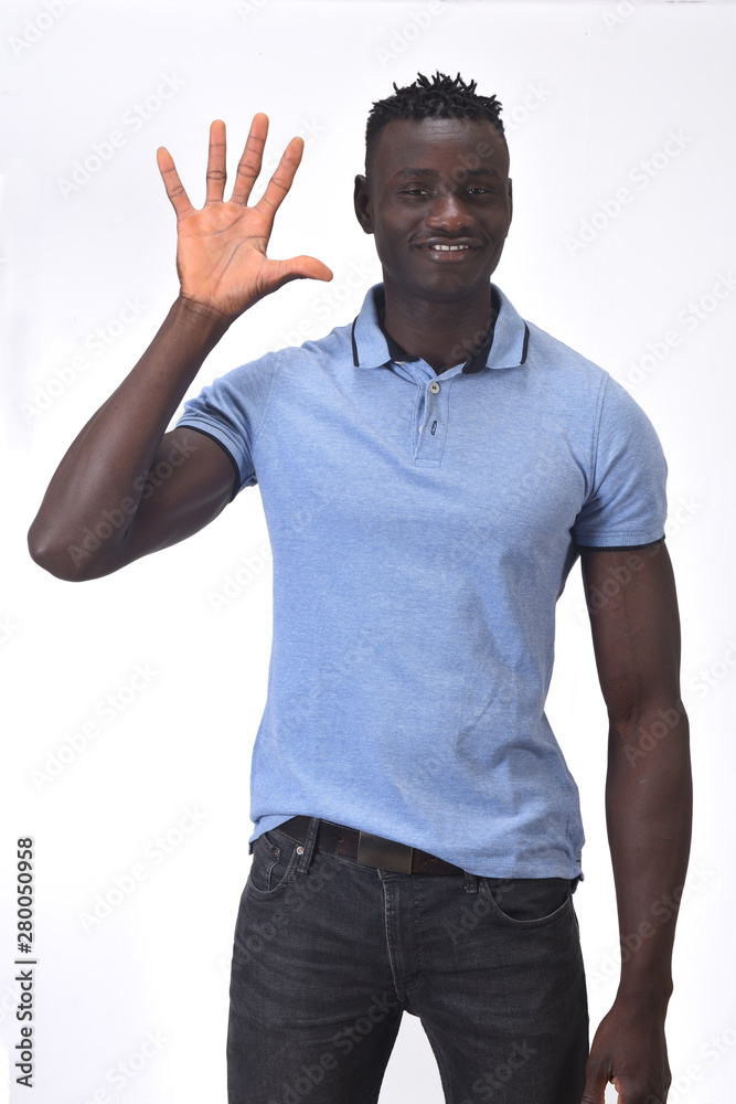 african man with finger in the shape of number five african man with finger in the shape of number five
