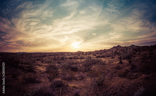 A sunset over the Sonoran Desert of Arizona with high altitude clouds panorama. © Jason Yoder