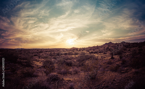 A sunset over the Sonoran Desert of Arizona with high altitude clouds panorama.