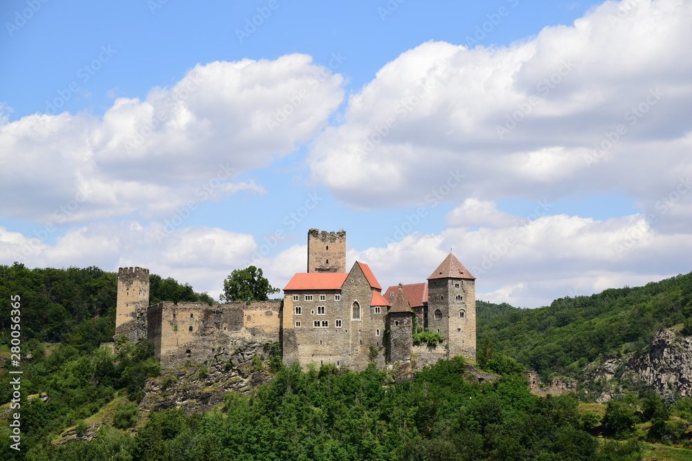 Hardegg medieval castle on a fortified hill in Thayatal National Park on sunny day with cloudy blue sky.