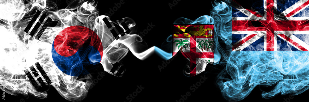 South Korea vs Fiji smoky mystic flags placed side by side. Thick colored silky abstract smoke flags of South Korean and Fiji South Korea vs Fiji smoky mystic flags placed side by side. Thick colored silky abstract smoke flags of South Korean and Fiji