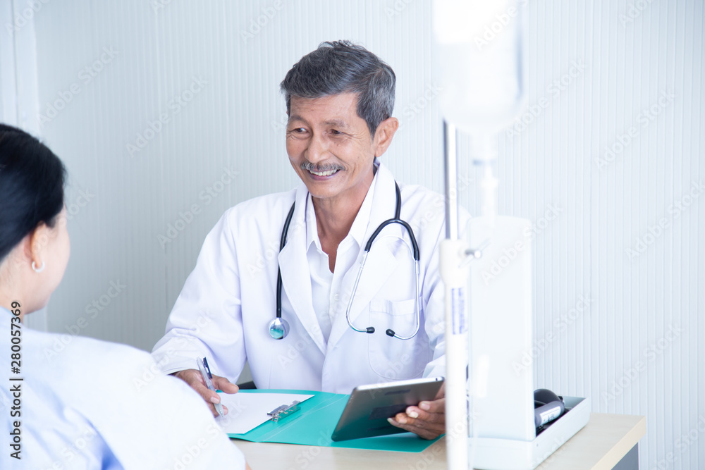 Senior male doctor smile discussing with speaking with his senior patient Senior male doctor smile discussing with speaking with his senior patient