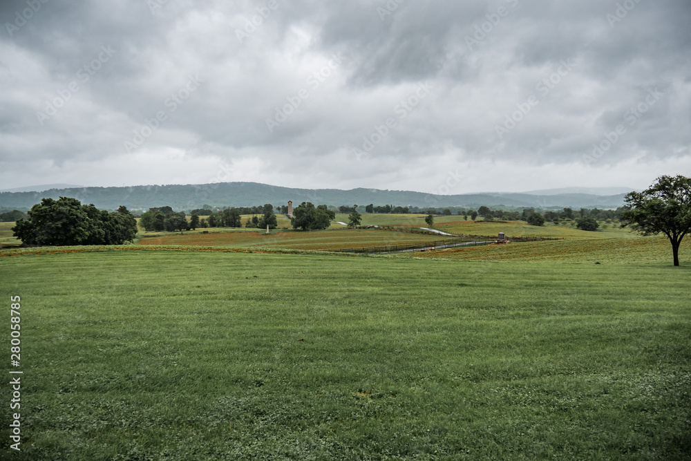 Cloudy storm over a field of grass