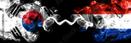 South Korea vs Paraguay, Paraguayan smoky mystic flags placed side by side. Thick colored silky abstract smoke flags of South Korean and Paraguay, Paraguayan photo