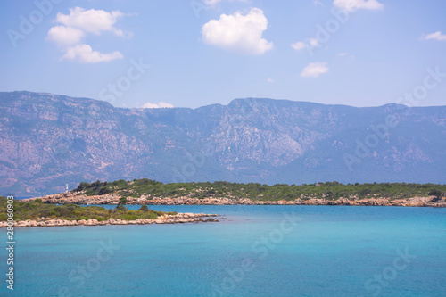 Aegean Islands on mountains and blue sky background, Turkey. Tropical wallpaper, paradise beach