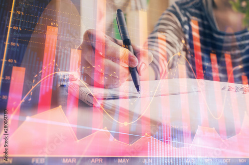 Wallpaper Mural Financial forex graph drawn over hands taking notes background. Concept of research. Double exposure Torontodigital.ca