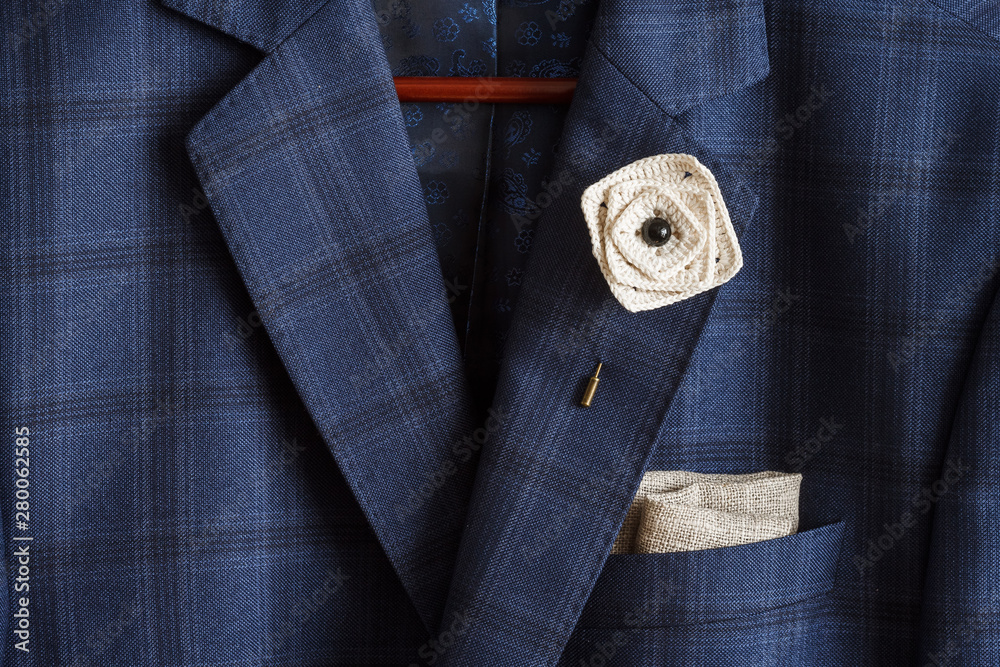 Crocheted brooch in the form of flowers and pocket square with