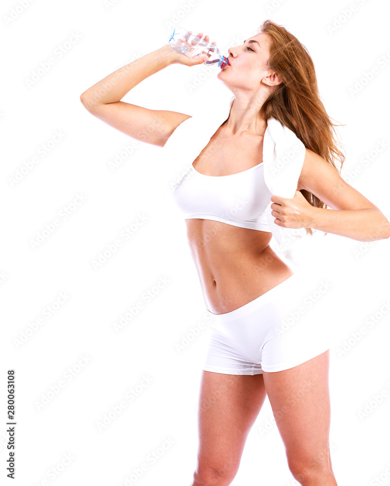 Fitness diet, Young beautiful blonde girl drinking water from a bottle Fitness diet, Young beautiful blonde girl drinking water from a bottle