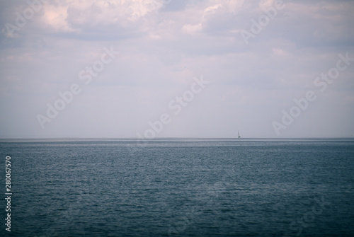 lonely sailboat on the sea