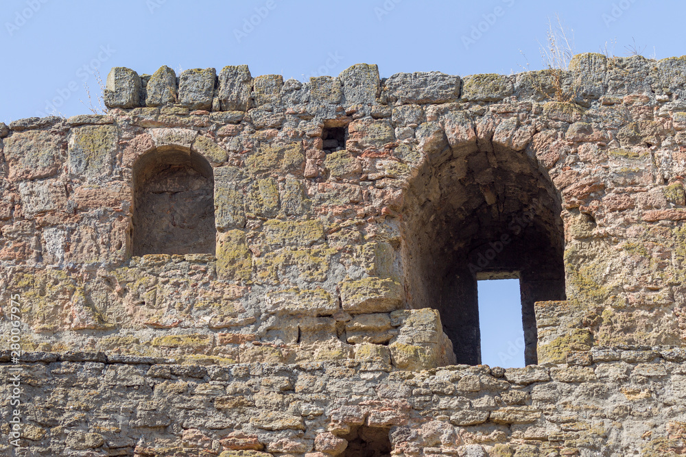 Ancient stone and brick Akkerman fortress, Belgorod-Dniester, Ukraine 13th century, part of the southeastern defensive wall. Fragment of the fortress wall, an ancient tile on a defensive tower