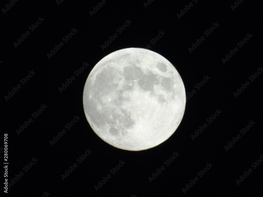 An amazing photography of the full moon over the city of Genova by night with a great clear sky in background and some stars An amazing photography of the full moon over the city of Genova by night with a great clear sky in background and some stars