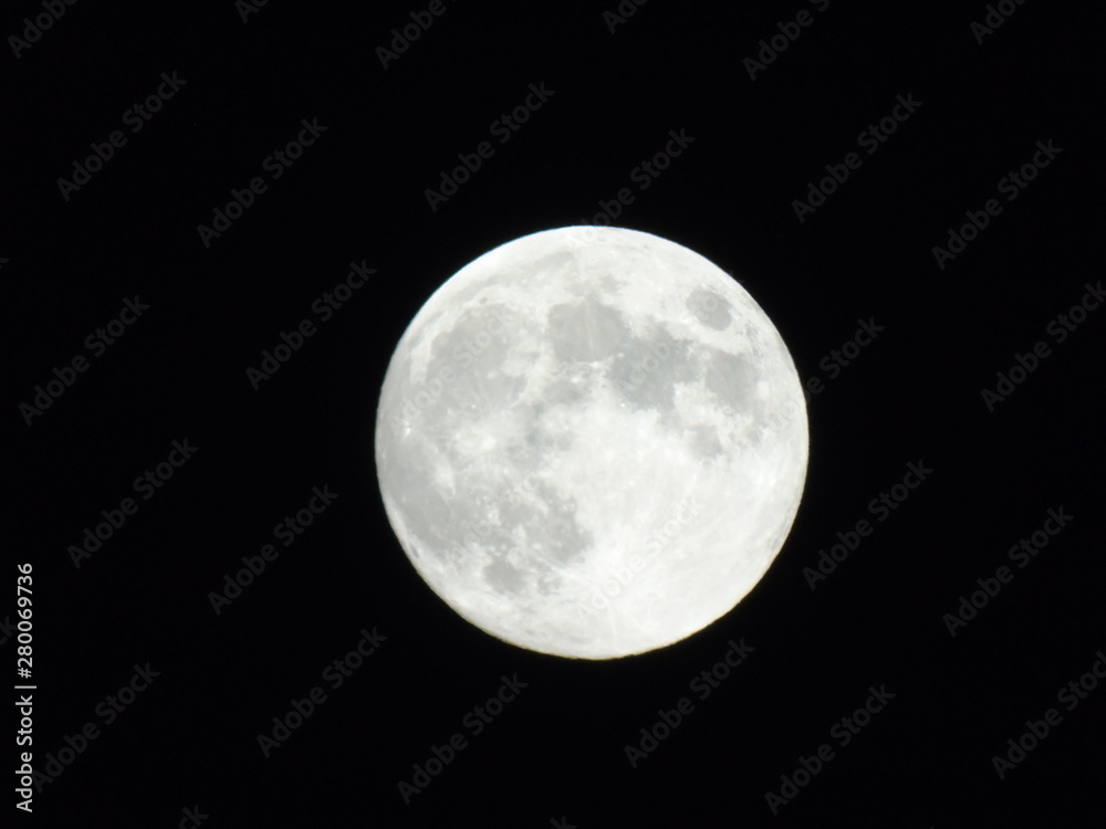An amazing photography of the full moon over the city of Genova by night with a great clear sky in background and some stars An amazing photography of the full moon over the city of Genova by night with a great clear sky in background and some stars