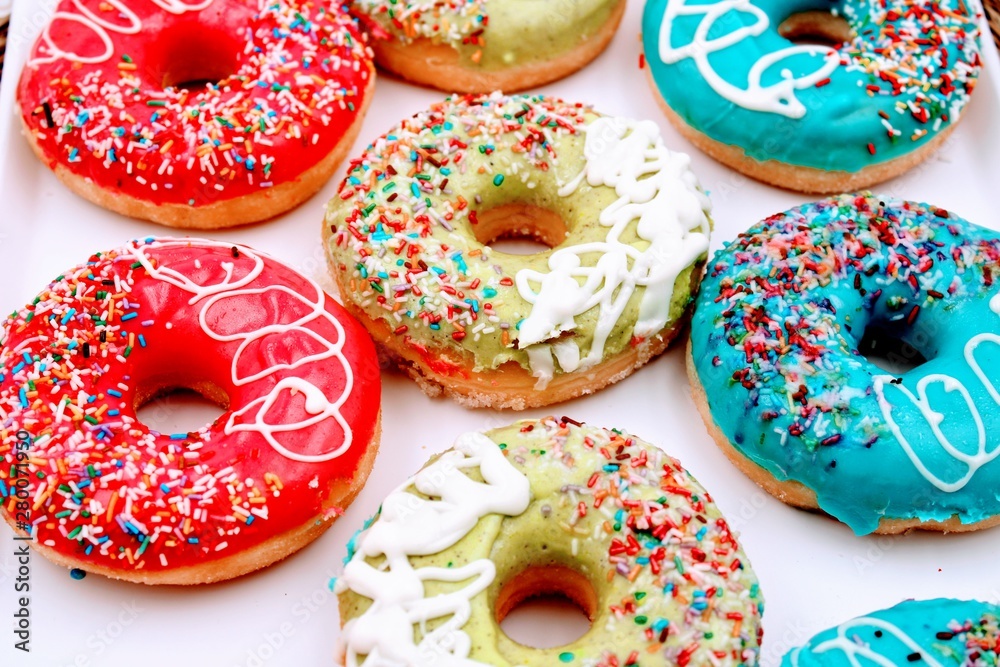 Delicious donuts with colorful chocolate Delicious donuts with colorful chocolate