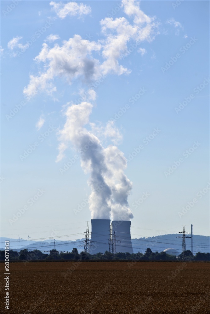 power plant cooling steam on background of blue sky power plant cooling steam on background of blue sky
