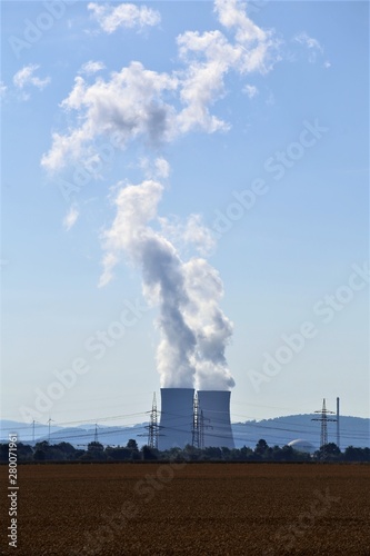power plant cooling steam on background of blue sky