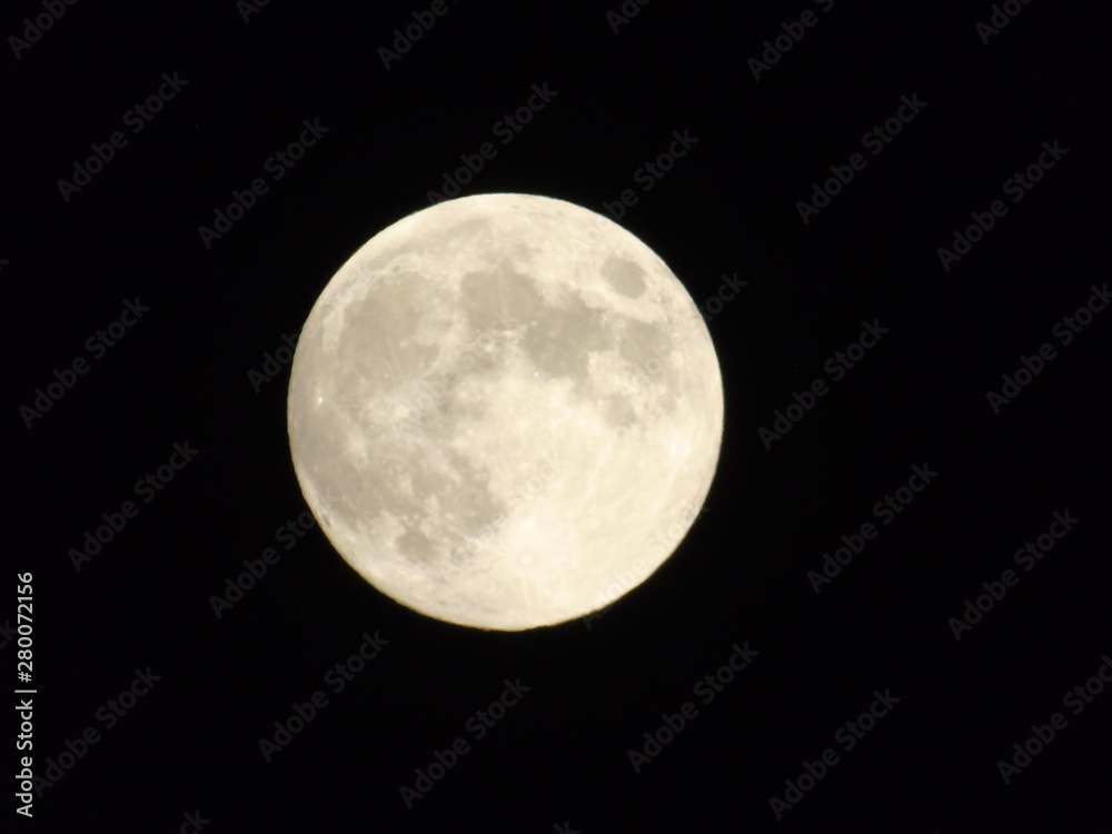 An amazing photography of the full moon over the city of Genova by night with a great clear sky in background and some stars An amazing photography of the full moon over the city of Genova by night with a great clear sky in background and some stars