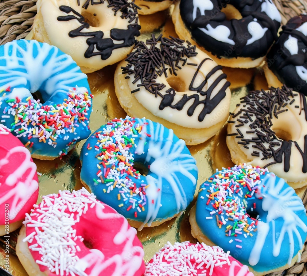 Delicious donuts with colorful chocolate