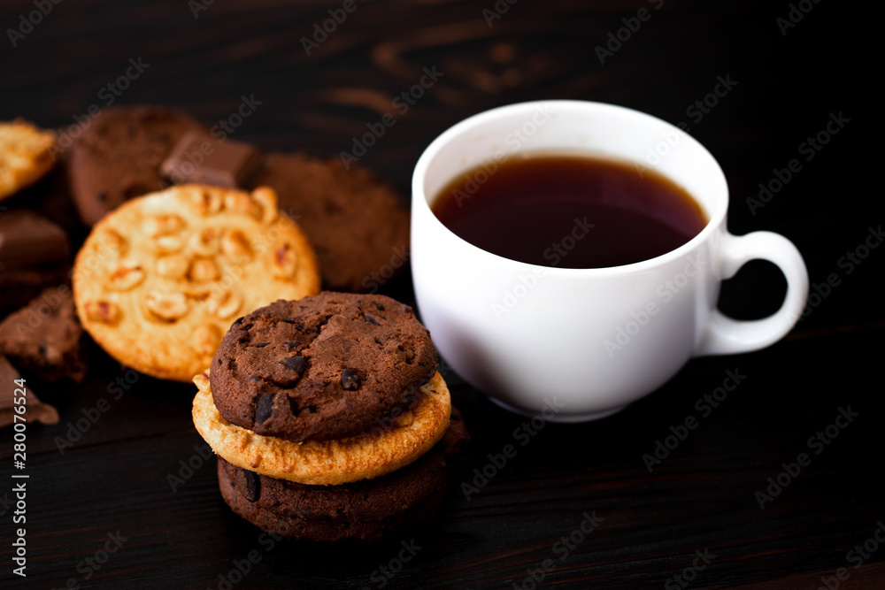 Chocolate cookies on wooden table.Homemade food on wooden background Chocolate cookies on wooden table.Homemade food on wooden background