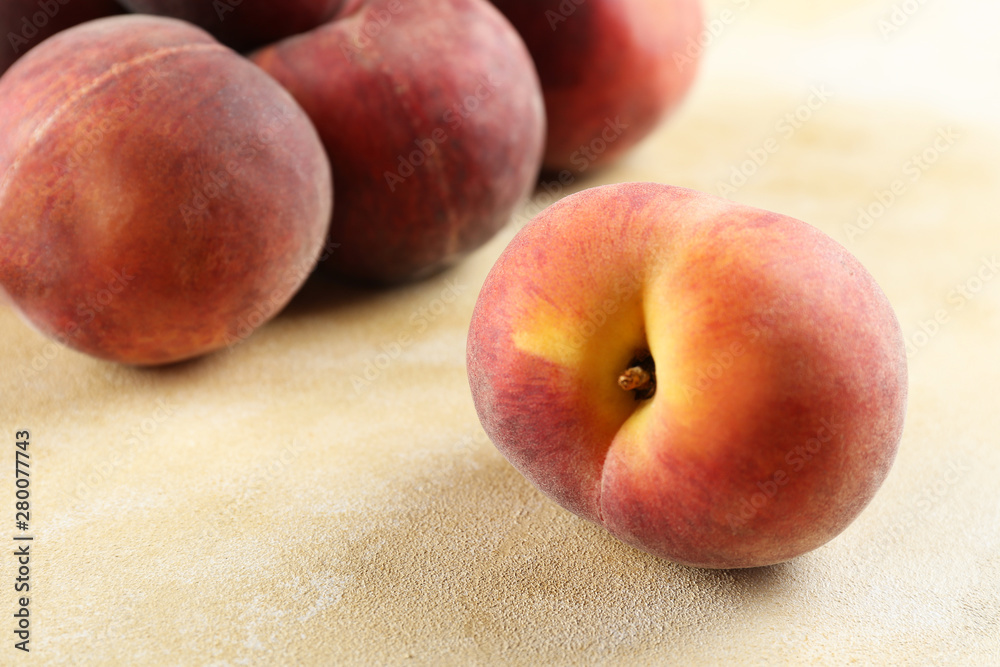 Bunch of ripe organic peaches in pile on textured table background. Local produce harvest heap on vintage style countertop. Clean eating concept. Top view, close up, copy space for text. Bunch of ripe organic peaches in pile on textured table background. Local produce harvest heap on vintage style countertop. Clean eating concept. Top view, close up, copy space for text.