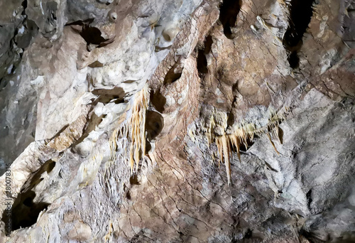 Stalactites in the cave as background