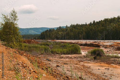 landscape with red soil polluted copper mining factory in Karabash  Russia  Chelyabinsk region  the dirtiest city on Earth