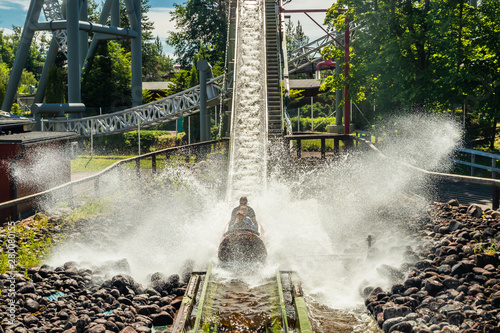 Fun water ride Log river in amusement park at summer