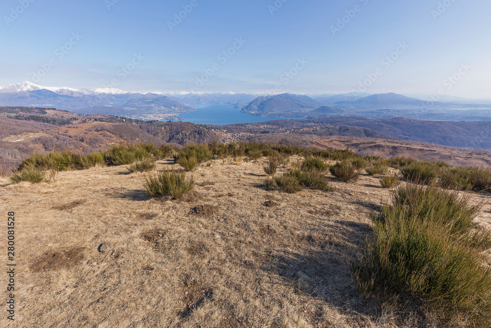 View of the Maggiore lake with the alps on the background, Piedmont, Italy.