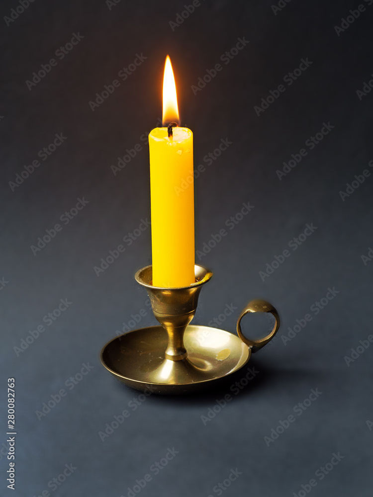 a single candle in a candlestick