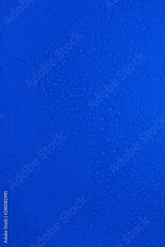 small drops of water on blue background