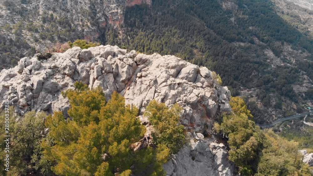 AERIAL View over cliff showing Mallorca Road. Tilt Down
