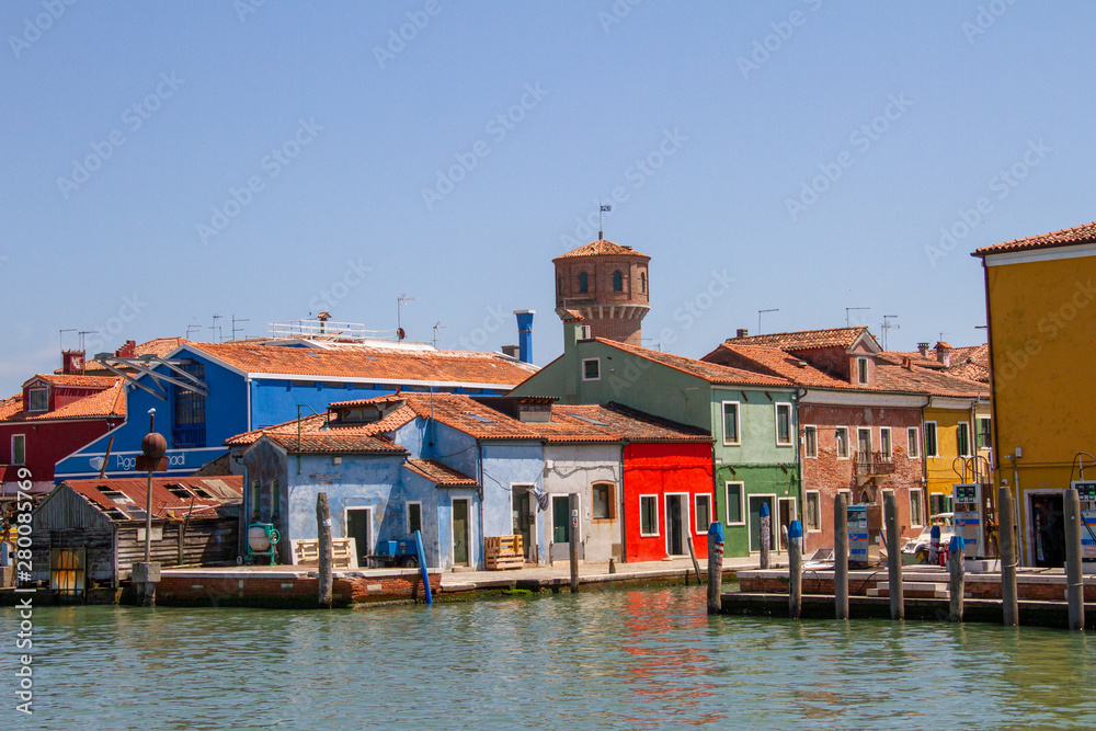 Colorful Fishermen houses in Burano lining the canal in Venice, Italy