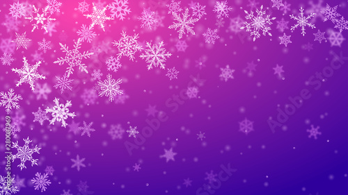 Christmas background of complex blurred and clear falling snowflakes in purple colors with bokeh effect