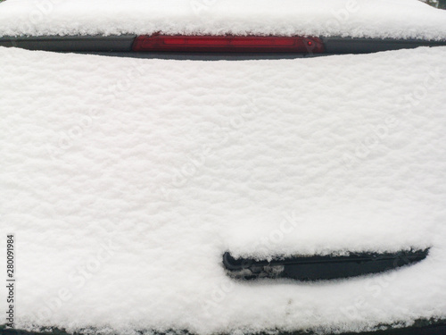 Snow on the rear window of the car. ar rear window in the snow photo